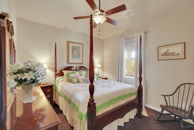 carpeted bedroom featuring a ceiling fan, visible vents, and baseboards