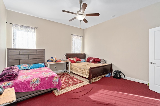 bedroom with multiple windows, baseboards, and a ceiling fan