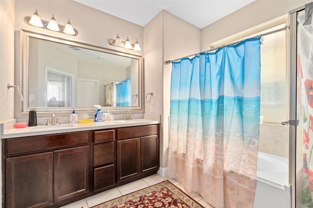 bathroom with double vanity, shower / tub combo, tile patterned flooring, and a sink