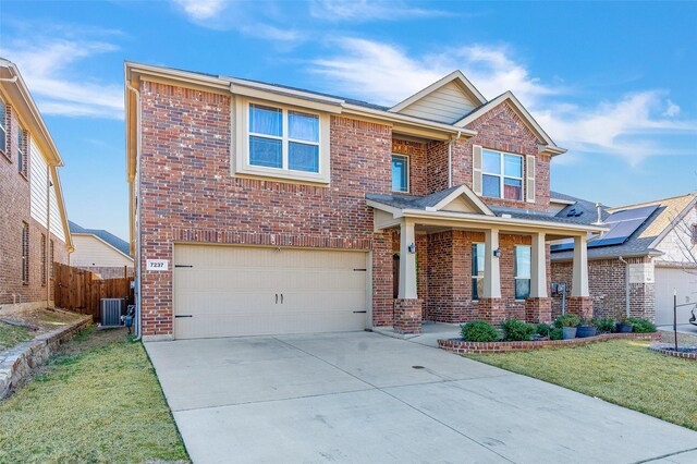 craftsman-style home with a front yard and a garage