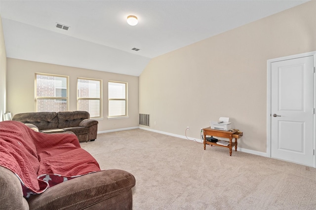 living area featuring lofted ceiling, baseboards, visible vents, and carpet flooring