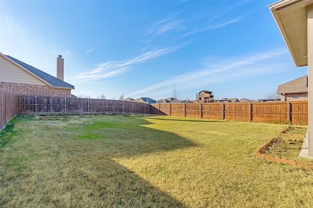 view of yard featuring a fenced backyard