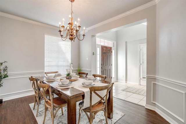 dining room with crown molding, a notable chandelier, and dark wood-type flooring