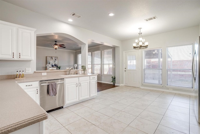 kitchen with sink, white cabinetry, ceiling fan with notable chandelier, hanging light fixtures, and appliances with stainless steel finishes