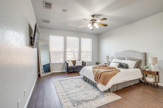 bedroom featuring dark wood-type flooring and ceiling fan