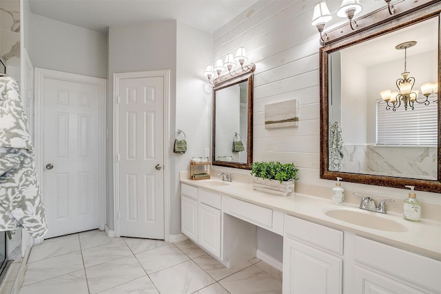 bathroom featuring an inviting chandelier and vanity