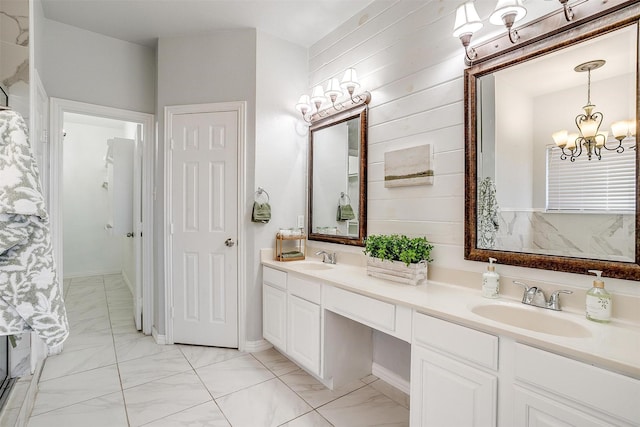 bathroom featuring a chandelier and vanity