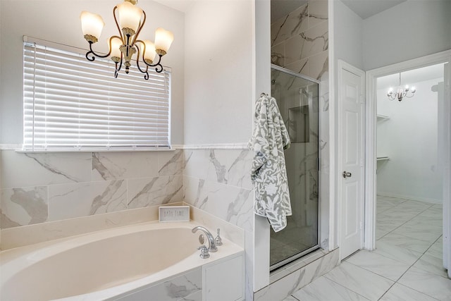 bathroom with shower with separate bathtub and a chandelier