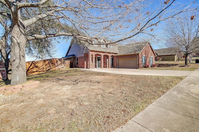 single story home featuring a front lawn and a garage