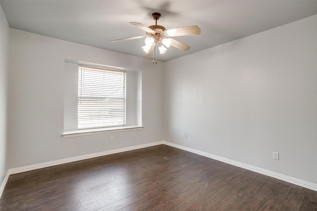 unfurnished room with ceiling fan and dark wood-type flooring