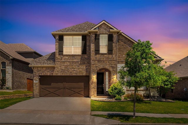 view of front of house with a lawn and a garage