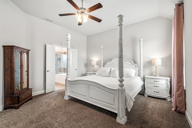 bedroom featuring connected bathroom, vaulted ceiling, ceiling fan, and dark colored carpet