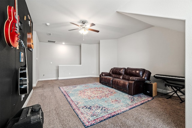 carpeted living room with ceiling fan