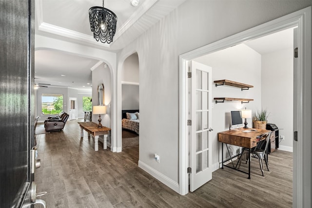 14872 Gladstone Dr, Aledo, TX 76008 - hall with crown molding, arched walkways, baseboards, and wood finished floors