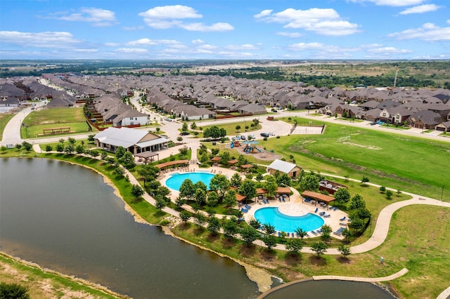 birds eye view of property with a water view