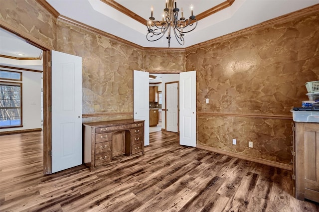 unfurnished living room featuring a tray ceiling and crown molding