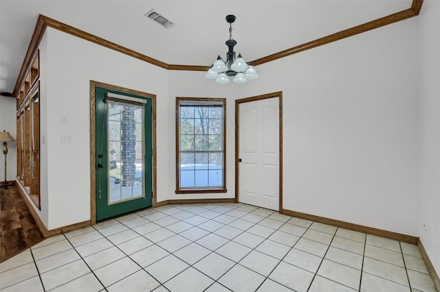 tiled foyer with ornamental molding and a notable chandelier