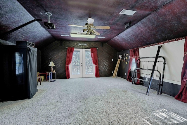 additional living space with ceiling fan, vaulted ceiling, and carpet flooring