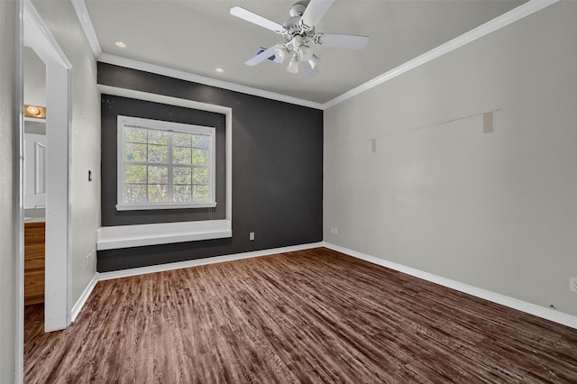 empty room featuring ornamental molding, ceiling fan, and hardwood / wood-style floors