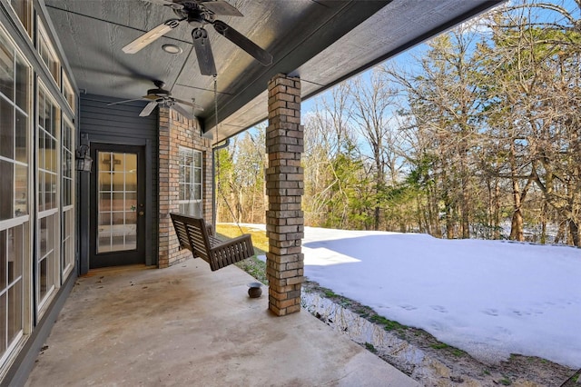 snow covered patio with ceiling fan