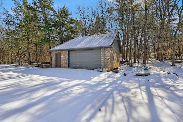 view of snow covered garage