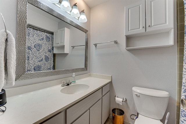 bathroom featuring vanity and toilet