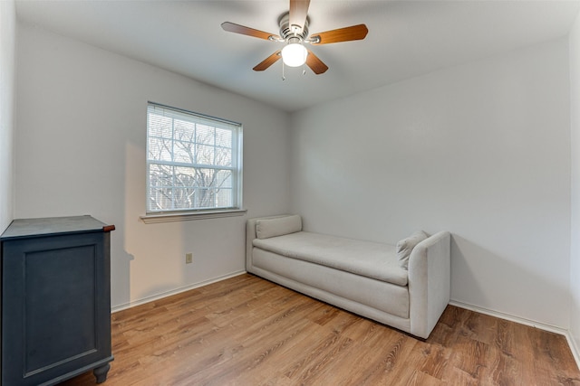 living area featuring ceiling fan and light wood-type flooring