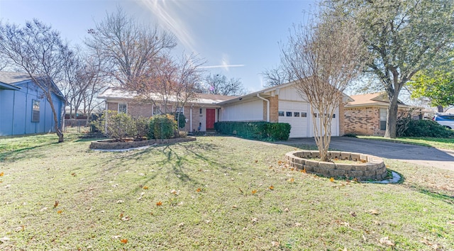 single story home featuring a garage and a front yard