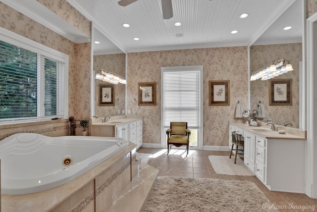 bathroom featuring tiled bath, tile patterned floors, crown molding, and vanity