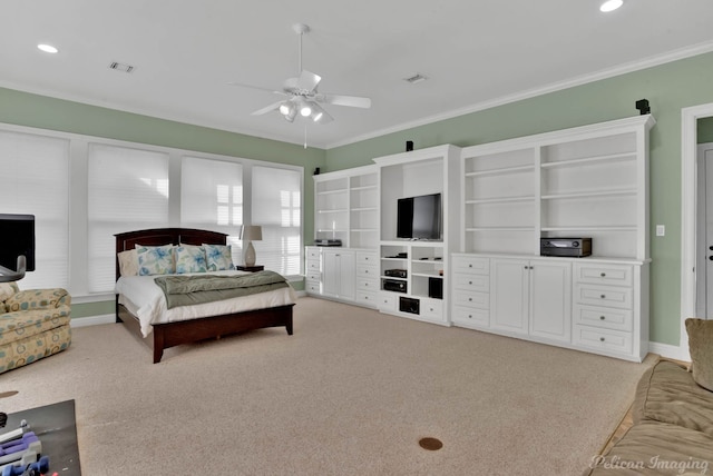 bedroom featuring ceiling fan, crown molding, and light carpet