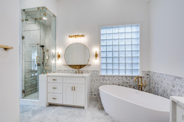 bathroom featuring tile walls, vanity, and independent shower and bath