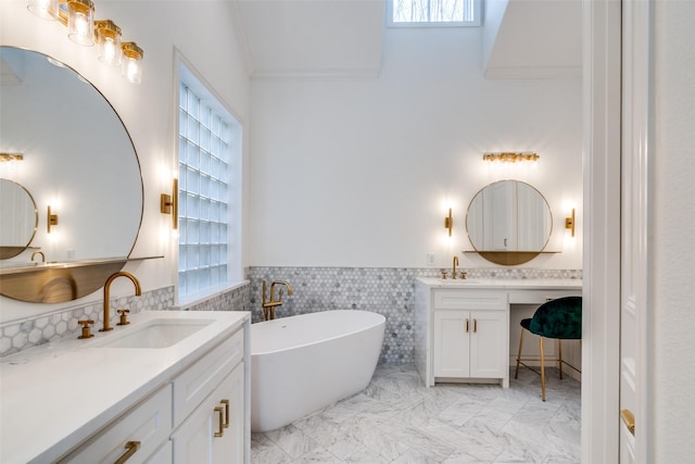 bathroom with vanity, tile walls, a washtub, and ornamental molding