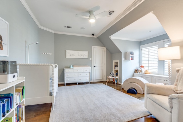 bedroom featuring ceiling fan, dark wood-type flooring, and crown molding