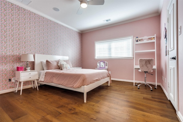 bedroom featuring ceiling fan, dark wood-type flooring, and crown molding