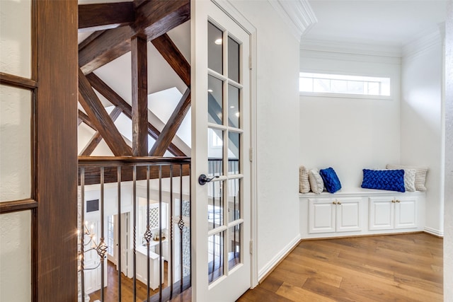 details with wood-type flooring and ornamental molding