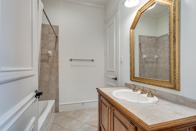 bathroom featuring vanity, tile patterned floors, crown molding, and tiled shower / bath