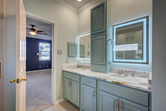 bathroom with ceiling fan, ornamental molding, and vanity