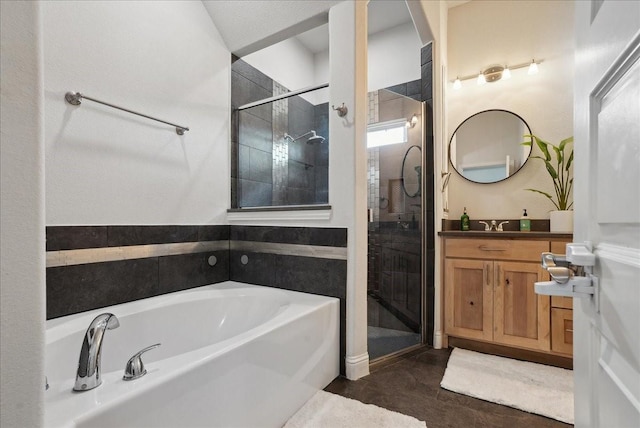 bathroom featuring vanity and plus walk in shower