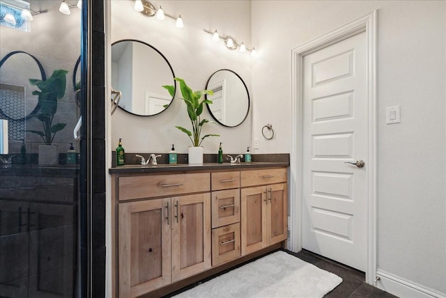 bathroom with vanity, tile patterned floors, and a shower with shower door