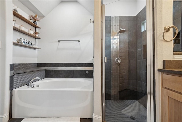 bathroom featuring shower with separate bathtub and vanity