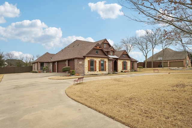 view of front of house with a front lawn and a garage