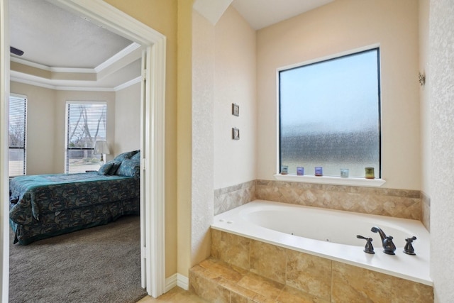 bathroom featuring tiled bath and crown molding