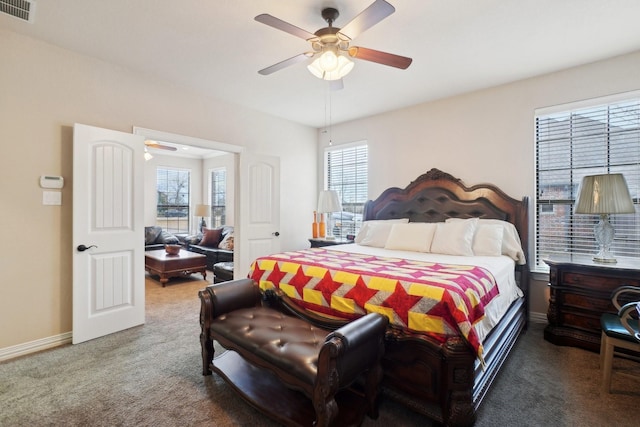 bedroom with ceiling fan and carpet