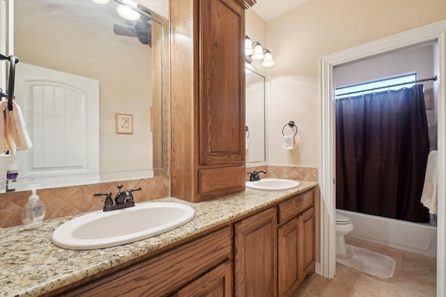 full bathroom with toilet, backsplash, shower / bath combination with curtain, tile patterned floors, and vanity