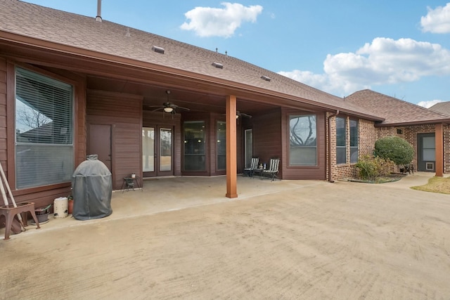 back of property featuring ceiling fan and a patio area