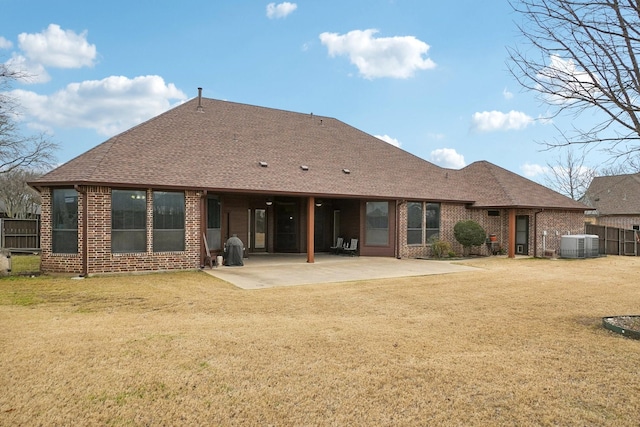 back of property featuring a patio area, central AC unit, and a lawn