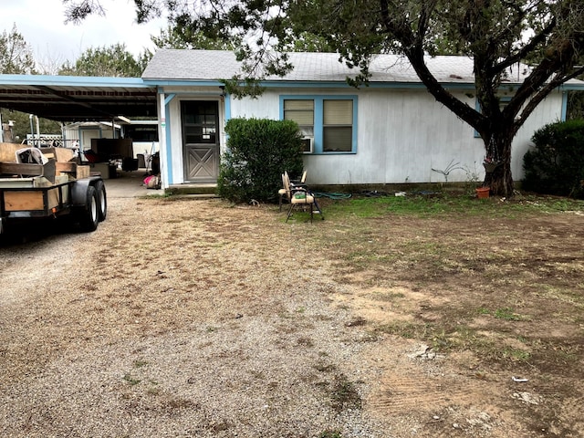 view of front of property featuring a carport