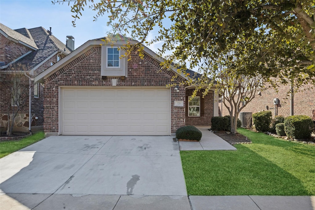 view of front property with a front yard and a garage