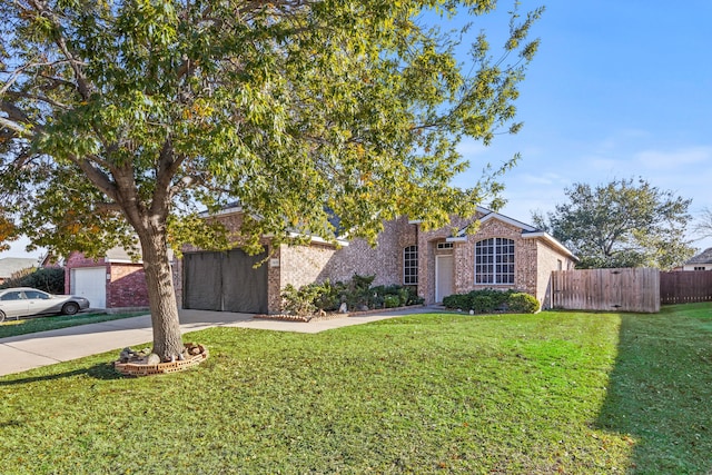 obstructed view of property with a garage and a front yard