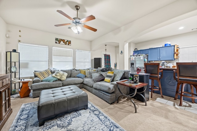 tiled living room featuring ceiling fan